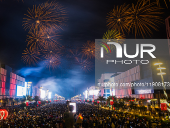 Fireworks and a drone show light up the midnight sky over Lusail Boulevard during the 2025 New Year's Day celebrations in Doha, Qatar, on Ja...