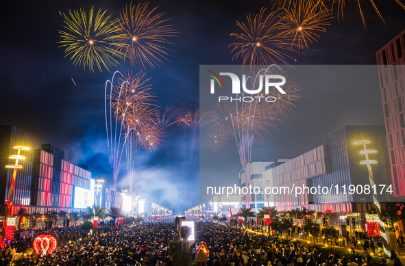 Fireworks and a drone show light up the midnight sky over Lusail Boulevard during the 2025 New Year's Day celebrations in Doha, Qatar, on Ja...