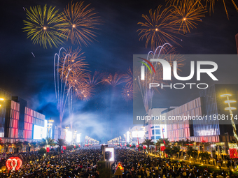 Fireworks and a drone show light up the midnight sky over Lusail Boulevard during the 2025 New Year's Day celebrations in Doha, Qatar, on Ja...