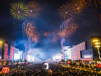 Fireworks and a drone show light up the midnight sky over Lusail Boulevard during the 2025 New Year's Day celebrations in Doha, Qatar, on Ja...