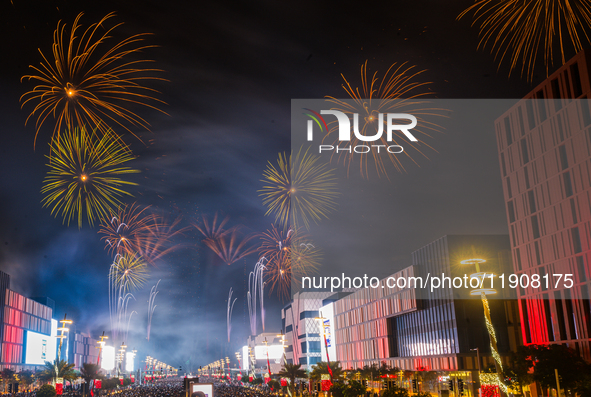 Fireworks and a drone show light up the midnight sky over Lusail Boulevard during the 2025 New Year's Day celebrations in Doha, Qatar, on Ja...