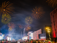 Fireworks and a drone show light up the midnight sky over Lusail Boulevard during the 2025 New Year's Day celebrations in Doha, Qatar, on Ja...