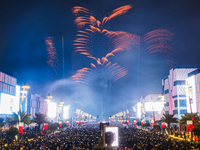 Fireworks and a drone show light up the midnight sky over Lusail Boulevard during the 2025 New Year's Day celebrations in Doha, Qatar, on Ja...