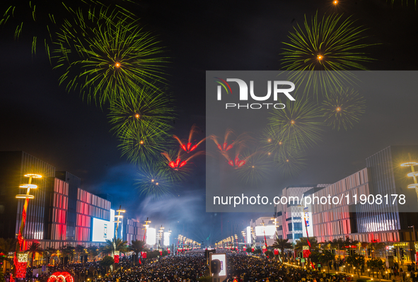 Fireworks and a drone show light up the midnight sky over Lusail Boulevard during the 2025 New Year's Day celebrations in Doha, Qatar, on Ja...