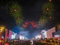 Fireworks and a drone show light up the midnight sky over Lusail Boulevard during the 2025 New Year's Day celebrations in Doha, Qatar, on Ja...