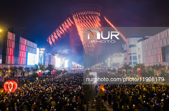 Fireworks and a drone show light up the midnight sky over Lusail Boulevard during the 2025 New Year's Day celebrations in Doha, Qatar, on Ja...