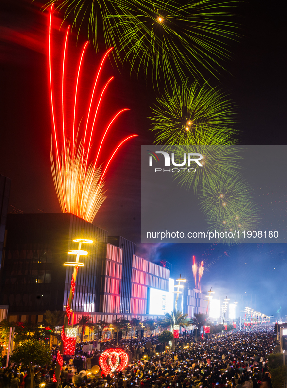 Fireworks and a drone show light up the midnight sky over Lusail Boulevard during the 2025 New Year's Day celebrations in Doha, Qatar, on Ja...