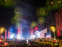 Fireworks and a drone show light up the midnight sky over Lusail Boulevard during the 2025 New Year's Day celebrations in Doha, Qatar, on Ja...