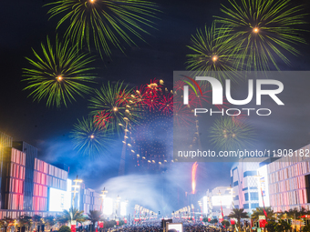 Fireworks and a drone show light up the midnight sky over Lusail Boulevard during the 2025 New Year's Day celebrations in Doha, Qatar, on Ja...