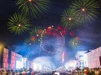 Fireworks and a drone show light up the midnight sky over Lusail Boulevard during the 2025 New Year's Day celebrations in Doha, Qatar, on Ja...