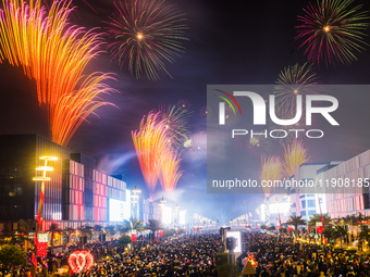 Fireworks and a drone show light up the midnight sky over Lusail Boulevard during the 2025 New Year's Day celebrations in Doha, Qatar, on Ja...