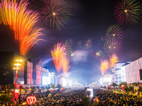 Fireworks and a drone show light up the midnight sky over Lusail Boulevard during the 2025 New Year's Day celebrations in Doha, Qatar, on Ja...