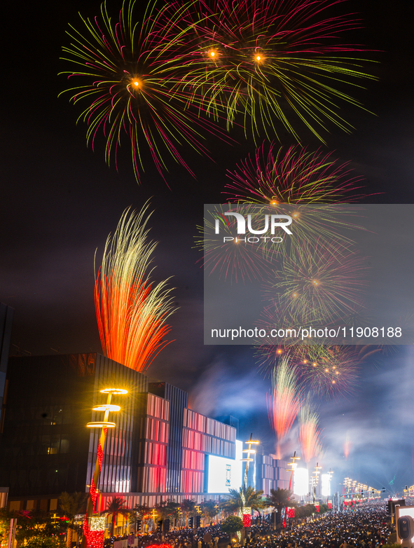 Fireworks and a drone show light up the midnight sky over Lusail Boulevard during the 2025 New Year's Day celebrations in Doha, Qatar, on Ja...