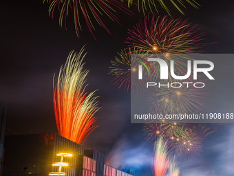 Fireworks and a drone show light up the midnight sky over Lusail Boulevard during the 2025 New Year's Day celebrations in Doha, Qatar, on Ja...