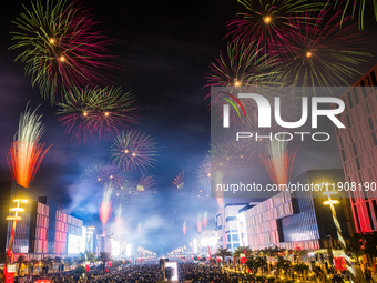 Fireworks and a drone show light up the midnight sky over Lusail Boulevard during the 2025 New Year's Day celebrations in Doha, Qatar, on Ja...