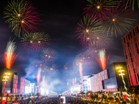 Fireworks and a drone show light up the midnight sky over Lusail Boulevard during the 2025 New Year's Day celebrations in Doha, Qatar, on Ja...