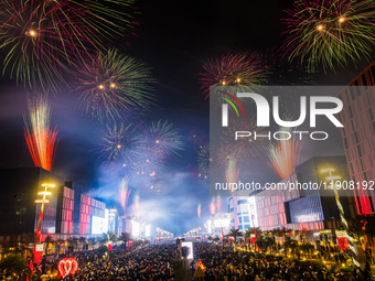 Fireworks and a drone show light up the midnight sky over Lusail Boulevard during the 2025 New Year's Day celebrations in Doha, Qatar, on Ja...