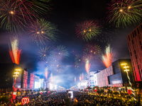 Fireworks and a drone show light up the midnight sky over Lusail Boulevard during the 2025 New Year's Day celebrations in Doha, Qatar, on Ja...