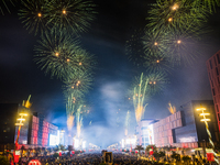 Fireworks and a drone show light up the midnight sky over Lusail Boulevard during the 2025 New Year's Day celebrations in Doha, Qatar, on Ja...