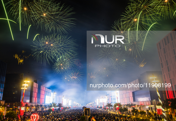 Fireworks and a drone show light up the midnight sky over Lusail Boulevard during the 2025 New Year's Day celebrations in Doha, Qatar, on Ja...