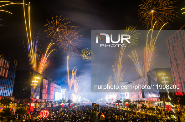 Fireworks and a drone show light up the midnight sky over Lusail Boulevard during the 2025 New Year's Day celebrations in Doha, Qatar, on Ja...