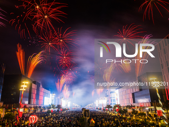 Fireworks and a drone show light up the midnight sky over Lusail Boulevard during the 2025 New Year's Day celebrations in Doha, Qatar, on Ja...