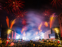 Fireworks and a drone show light up the midnight sky over Lusail Boulevard during the 2025 New Year's Day celebrations in Doha, Qatar, on Ja...