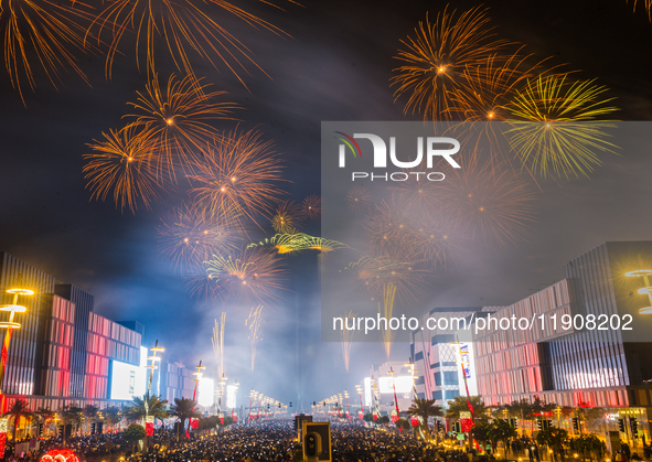 Fireworks and a drone show light up the midnight sky over Lusail Boulevard during the 2025 New Year's Day celebrations in Doha, Qatar, on Ja...