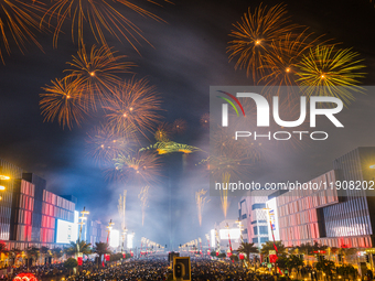 Fireworks and a drone show light up the midnight sky over Lusail Boulevard during the 2025 New Year's Day celebrations in Doha, Qatar, on Ja...