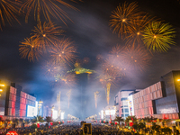 Fireworks and a drone show light up the midnight sky over Lusail Boulevard during the 2025 New Year's Day celebrations in Doha, Qatar, on Ja...