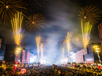 Fireworks and a drone show light up the midnight sky over Lusail Boulevard during the 2025 New Year's Day celebrations in Doha, Qatar, on Ja...