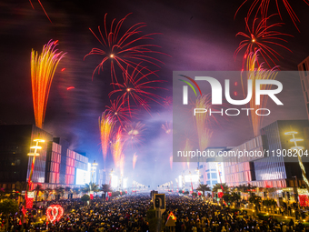 Fireworks and a drone show light up the midnight sky over Lusail Boulevard during the 2025 New Year's Day celebrations in Doha, Qatar, on Ja...