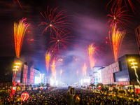 Fireworks and a drone show light up the midnight sky over Lusail Boulevard during the 2025 New Year's Day celebrations in Doha, Qatar, on Ja...