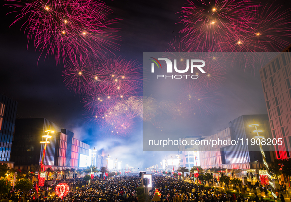 Fireworks and a drone show light up the midnight sky over Lusail Boulevard during the 2025 New Year's Day celebrations in Doha, Qatar, on Ja...