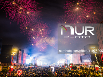 Fireworks and a drone show light up the midnight sky over Lusail Boulevard during the 2025 New Year's Day celebrations in Doha, Qatar, on Ja...