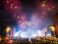 Fireworks and a drone show light up the midnight sky over Lusail Boulevard during the 2025 New Year's Day celebrations in Doha, Qatar, on Ja...