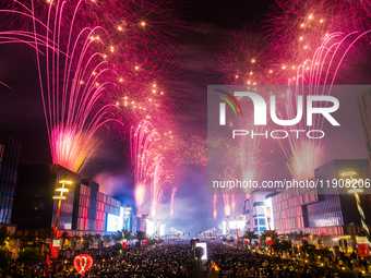 Fireworks and a drone show light up the midnight sky over Lusail Boulevard during the 2025 New Year's Day celebrations in Doha, Qatar, on Ja...