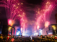 Fireworks and a drone show light up the midnight sky over Lusail Boulevard during the 2025 New Year's Day celebrations in Doha, Qatar, on Ja...