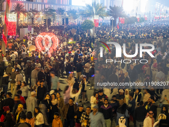 People gather at Lusail Boulevard during New Year's Day celebrations in Doha, Qatar, on January 1, 2025. (