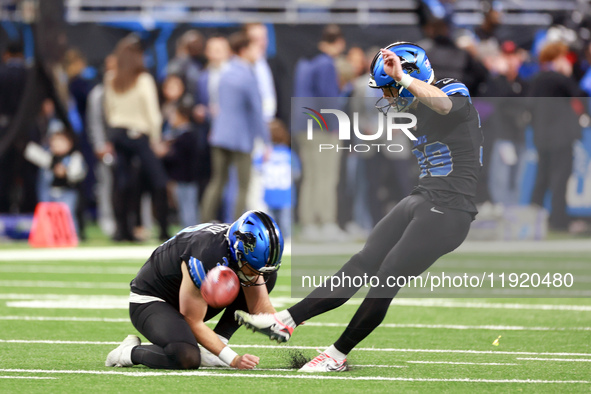 DETROIT,MICHIGAN-JANUARY 5:  Place kicker Jake Bates (39) of the Detroit Lions kicks the ball held by punter Jack Fox (3) of the Detroit Lio...