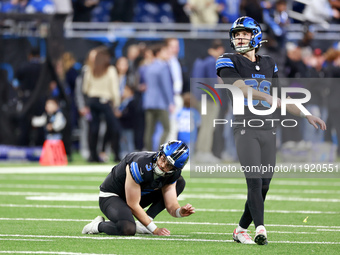 DETROIT,MICHIGAN-JANUARY 5: Place kicker Jake Bates (39) of the Detroit Lions follows his kick which was held by punter Jack Fox (3) of the...