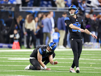 DETROIT,MICHIGAN-JANUARY 5: Place kicker Jake Bates (39) of the Detroit Lions follows his kick which was held by punter Jack Fox (3) of the...