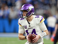 DETROIT,MICHIGAN-JANUARY 5:  Quarterback Sam Darnold (14) of the Minnesota Vikings receives the ball ahead of a game between the Detroit Lio...