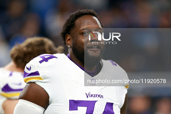 DETROIT,MICHIGAN-JANUARY 5:  Offensive tackle Cam Robinson (74) of the Minnesota Vikings j walks on the field ahead of a game between the De...