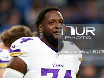 DETROIT,MICHIGAN-JANUARY 5:  Offensive tackle Cam Robinson (74) of the Minnesota Vikings j walks on the field ahead of a game between the De...