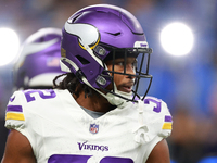 DETROIT,MICHIGAN-JANUARY 5:  Running back Ty Chandler (32) of the Minnesota Vikings walks on the field ahead of a game between the Detroit L...