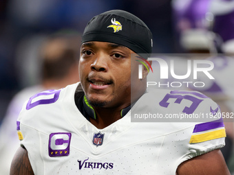 DETROIT,MICHIGAN-JANUARY 5:  Fullback C.J. Ham (30) of the Minnesota Vikings walks on the field ahead of a game between the Detroit Lions an...