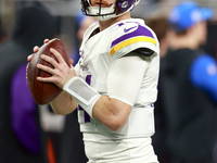 DETROIT,MICHIGAN-JANUARY 5:  Quarterback Sam Darnold (14) of the Minnesota Vikings looks to throw the ball ahead of a game between the Detro...