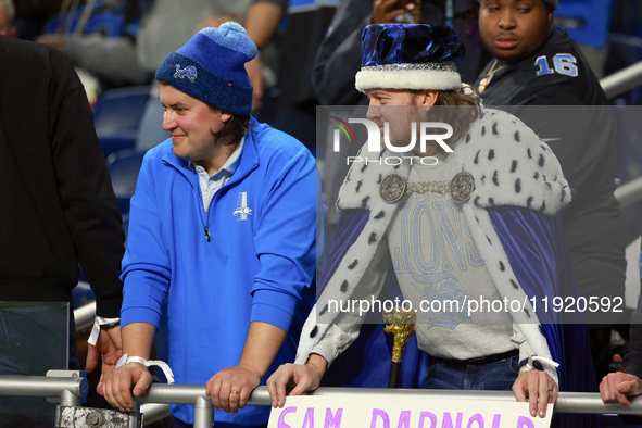 DETROIT,MICHIGAN-JANUARY 5: Fans in Lions spirit wear look on during a game between the Detroit Lions and the Minnesota Vikings in Detroit,...