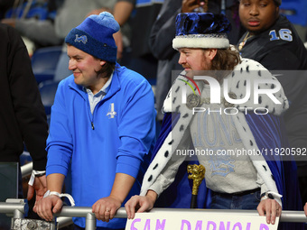 DETROIT,MICHIGAN-JANUARY 5: Fans in Lions spirit wear look on during a game between the Detroit Lions and the Minnesota Vikings in Detroit,...